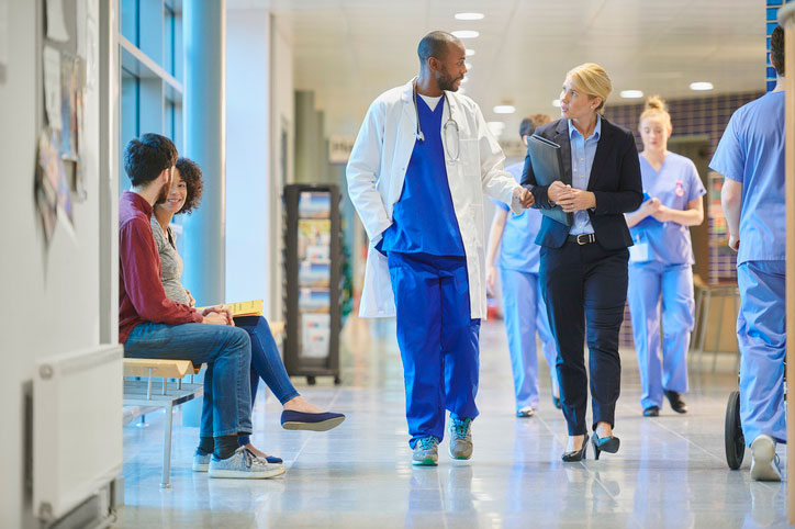 healthcare executive walking with doctor